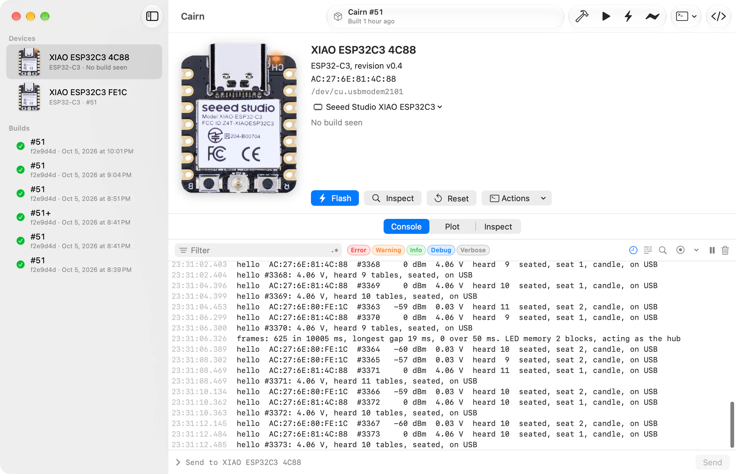 Bench’s window for a project called Cairn. The sidebar lists two boards, XIAO ESP32C3 4C88 and XIAO ESP32C3 FE1C, above six builds numbered 51. The selected board’s photo sits beside its chip, MAC address, port and board type, with Flash, Inspect, Reset and Actions buttons. Below, its console streams timestamped lines.